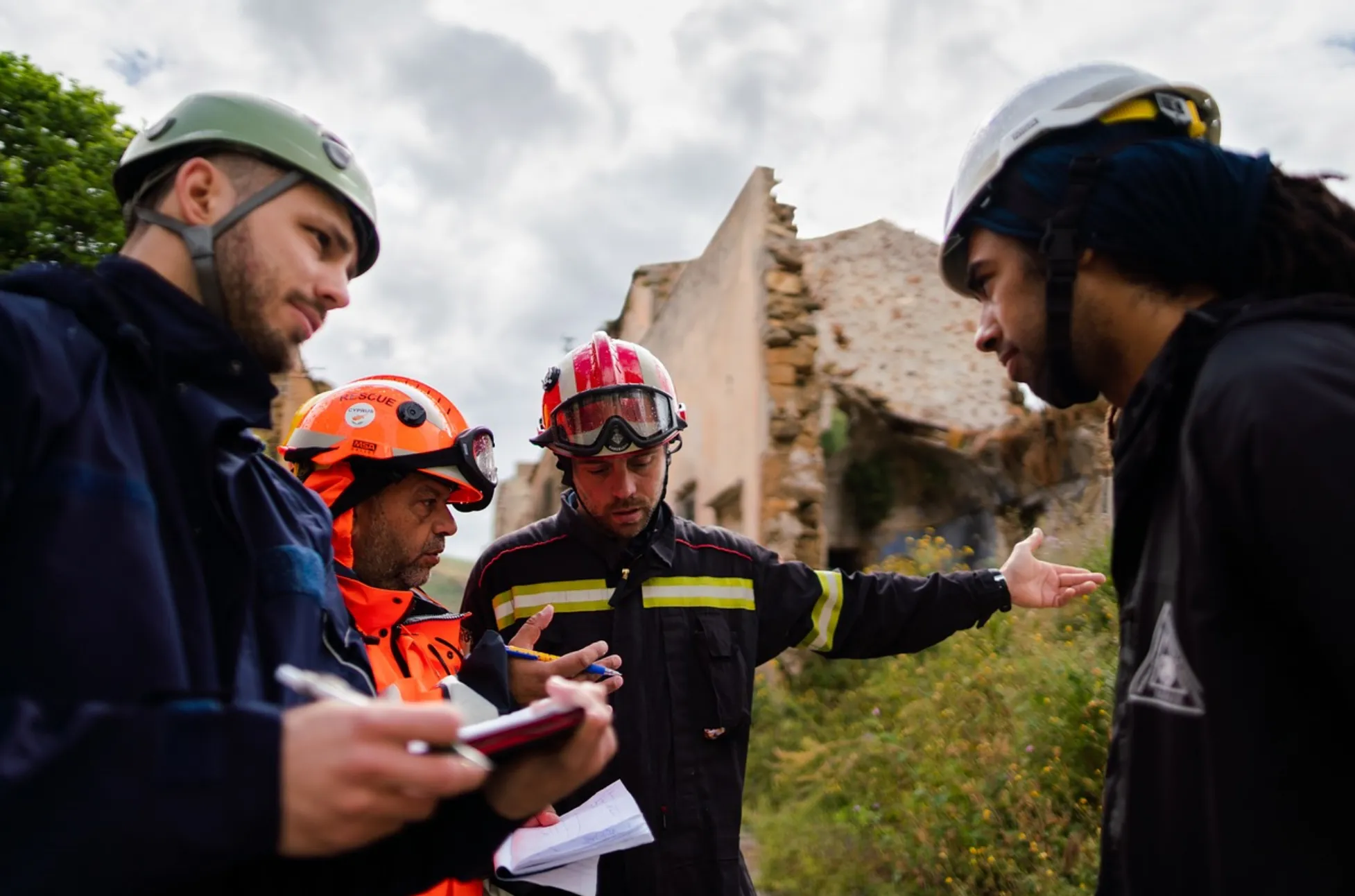 Friendly plumber and homeowner reviewing a plumbing diagram in a bright Auburn, CA kitchen.