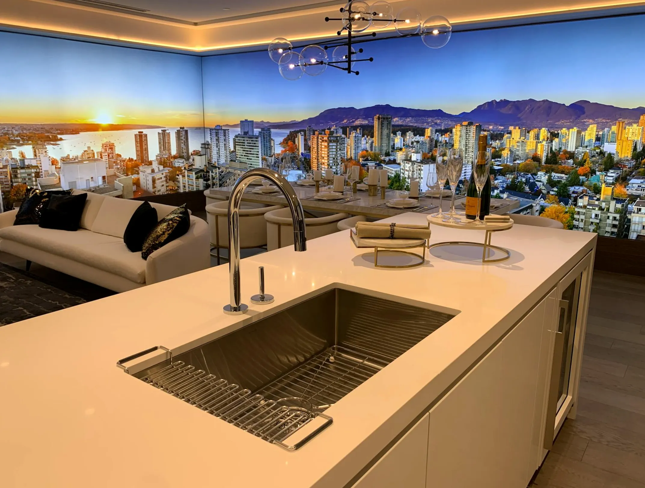 Overhead view of a clean, modern Rancho Cordova kitchen sink with a small compost bin and minimal scraps near the disposal opening.