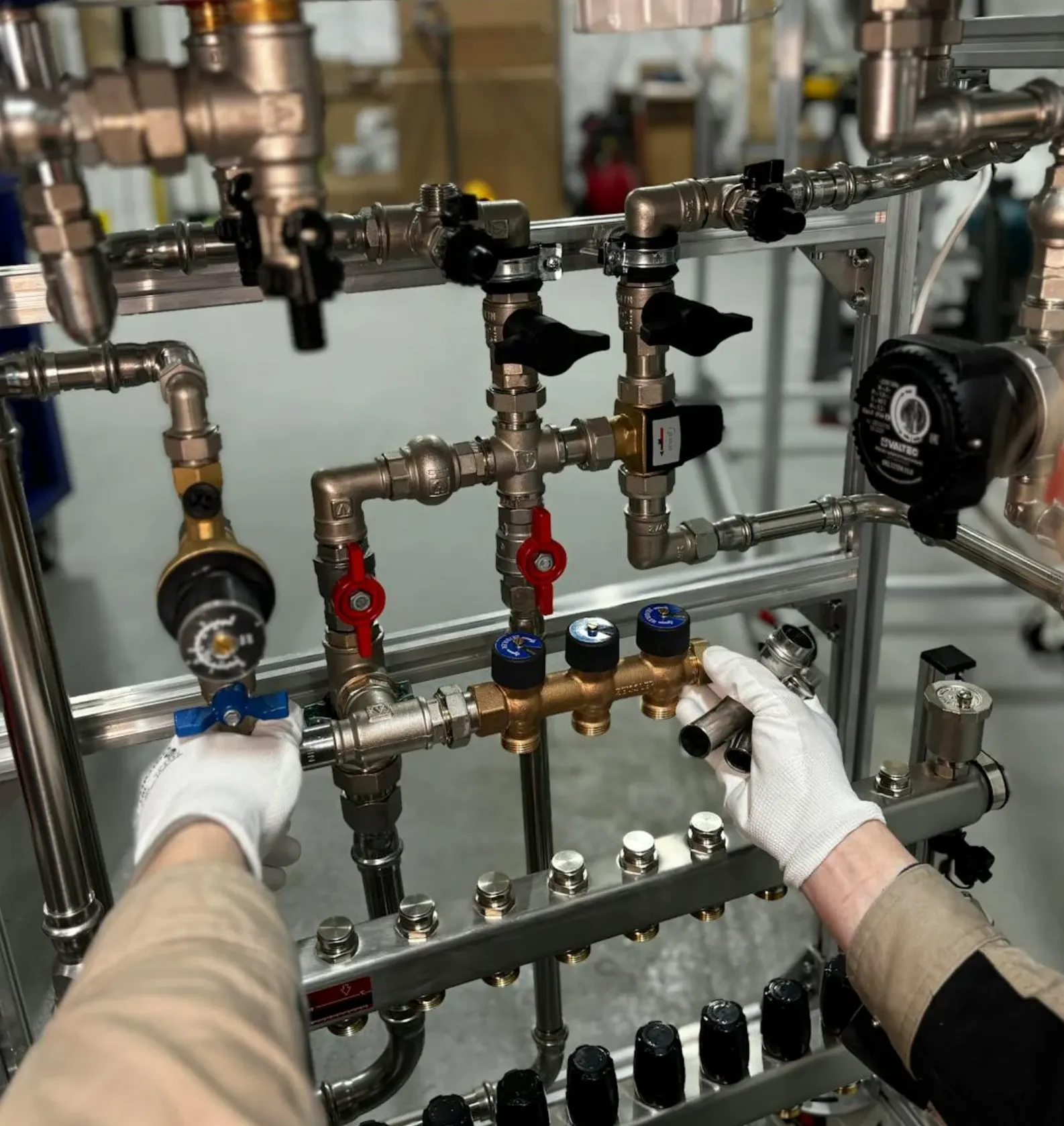 Happy Rocklin family in a bright kitchen, running water at the sink and filling a pot, with no visible signs of wall patches or construction.